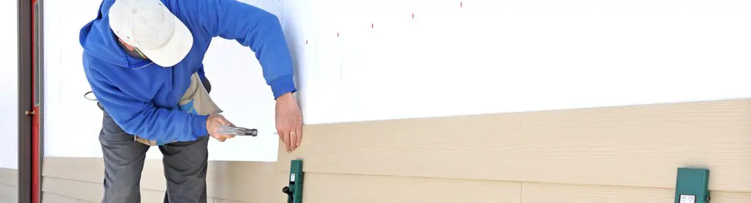 Siding Installation By A Worker